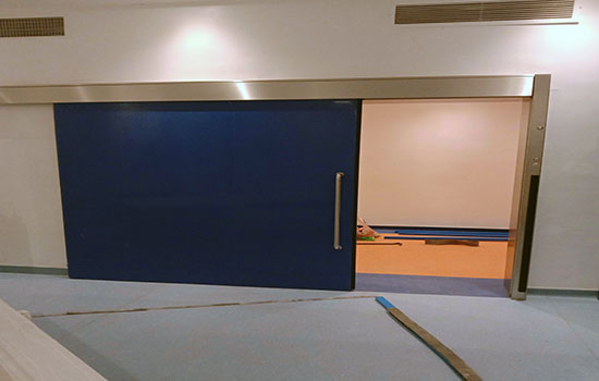 Automated solid Sliding Lead door 